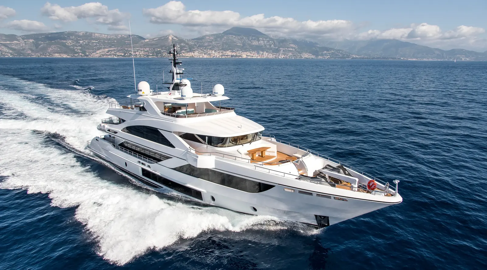 Luxury yacht at marina at dusk